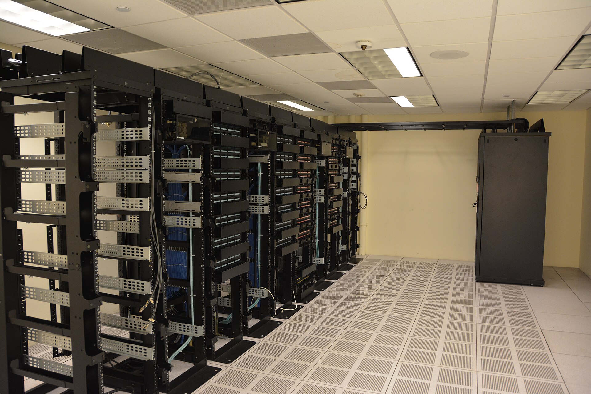 Long corridor of server racks in a data center